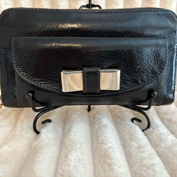 Sold.
Chloe Black Leather Wallet with Gold Bow Hardware. Refurbished - Picture 1 of 10